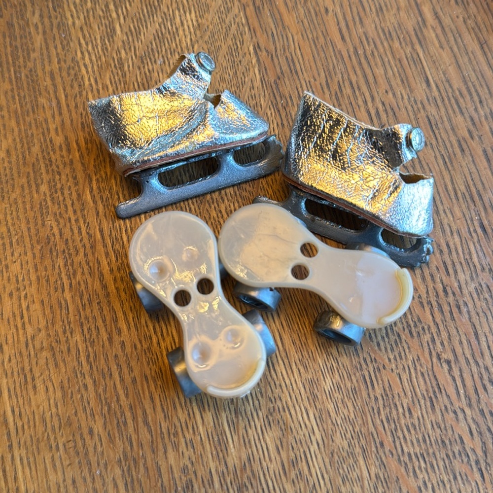 Vintage pair of doll shoe accessories, a pair of ice skates and roller skates